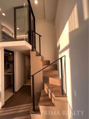 Modern staircase leading to loft area in a stylish apartment