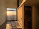 Sunset view from modern living room with balcony access