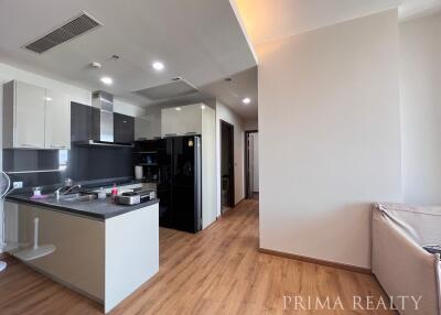 Modern kitchen with adjacent living area in an apartment