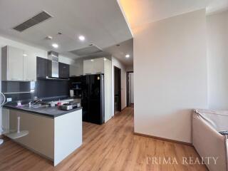 Modern kitchen with adjacent living area in an apartment