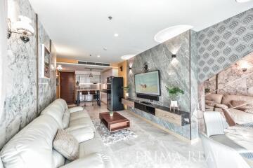 Elegant and modern living room seamlessly connected to a kitchen area