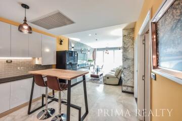 Modern kitchen with open plan layout leading into the living area