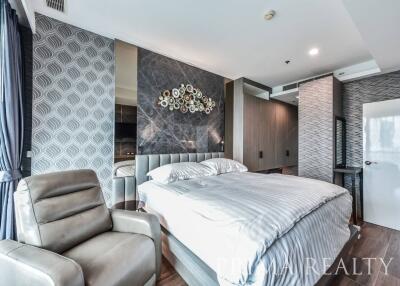 Modern bedroom interior with a comfortable bed, elegant decor, and tasteful design