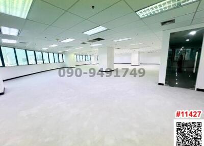 Spacious commercial office interior with bright lighting