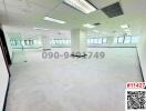 Spacious and bright empty office space with large windows