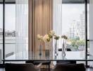 Elegant living room with a view of the city skyline through large glass windows