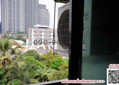 View from balcony with air conditioning unit overlooking urban landscape
