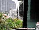 View from balcony with air conditioning unit overlooking urban landscape