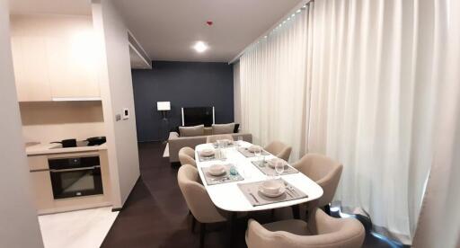 Modern dining area with adjoining living space in a contemporary apartment