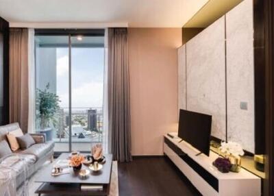 Modern apartment living area with an open view to the bedroom, featuring elegant decor and ample natural light