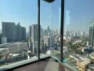 Spacious living room with panoramic city views through floor-to-ceiling windows