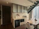 Modern kitchen with integrated dining area and city view