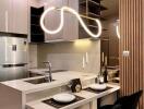 Modern kitchen with integrated appliances and stylish lighting fixtures