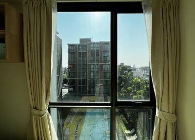 View from bedroom window overlooking urban landscape