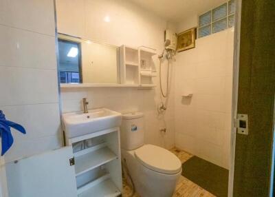 Compact bathroom with white fixtures