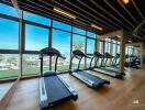 Spacious gym area with ocean view and modern equipment
