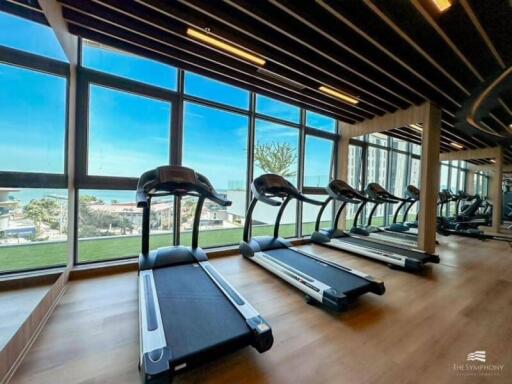 Spacious gym area with ocean view and modern equipment