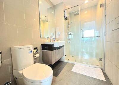 Modern bathroom with glass shower and stylish vanity