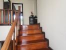 Elegant wooden staircase inside a home leading to the upper floor