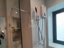 Modern bathroom with glass shower and mounted water heater