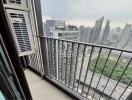 Urban high-rise apartment balcony with cityscape view