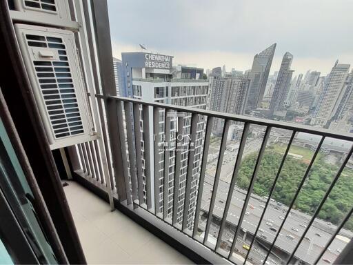Urban high-rise apartment balcony with cityscape view