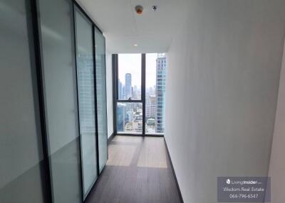 Modern bedroom with large windows and city view