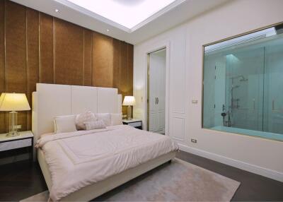Modern bedroom with en-suite glass bathroom
