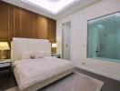 Modern bedroom with en-suite glass bathroom