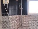 Modern bathroom with wall-mounted shower unit and stylish tiling