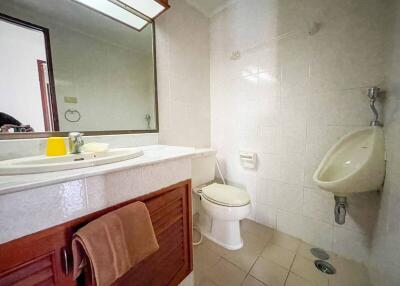 Spacious well-lit bathroom with modern amenities