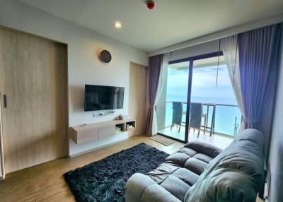 Spacious living room with ocean view and modern furnishings
