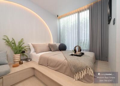 Modern bedroom with large bed and elegant lighting