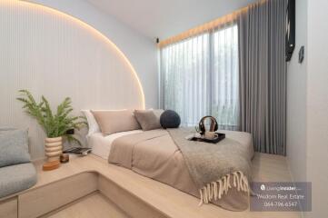 Modern bedroom with large bed and elegant lighting