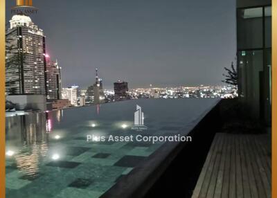 Luxurious rooftop pool with city skyline view at night