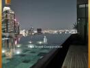 Luxurious rooftop pool with city skyline view at night