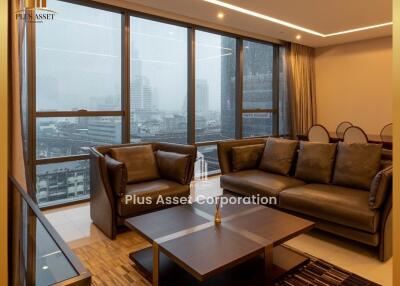 Elegant living room with large windows and city view