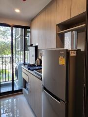 Modern compact kitchen with appliances and ample storage