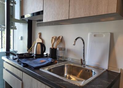 Modern kitchen with stainless steel appliances and wooden cabinets