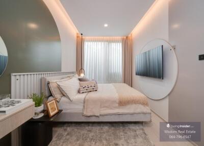 Modern well-lit bedroom with stylish decor