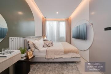 Modern well-lit bedroom with stylish decor