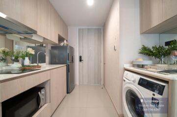 Modern compact kitchen in an apartment with integrated appliances