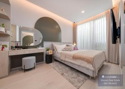 Modern bedroom interior with neutral tones and stylish furnishings