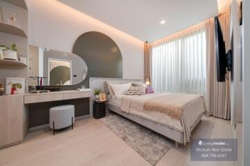 Modern bedroom interior with neutral tones and stylish furnishings