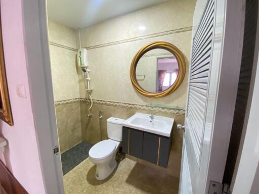 Compact bathroom with modern amenities