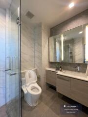 Modern bathroom with spacious shower and elegant vanity