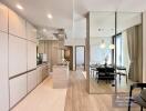 Modern open kitchen with dining area in a well-lit apartment