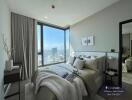 Modern bedroom with panoramic city view and ample natural light