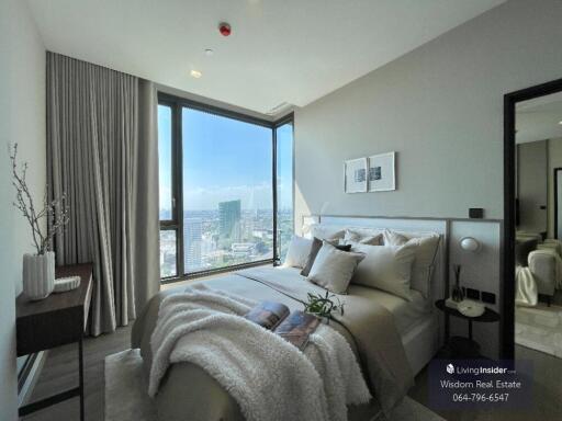 Modern bedroom with panoramic city view and ample natural light