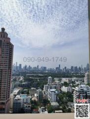 View from high-rise building balcony overlooking a cityscape